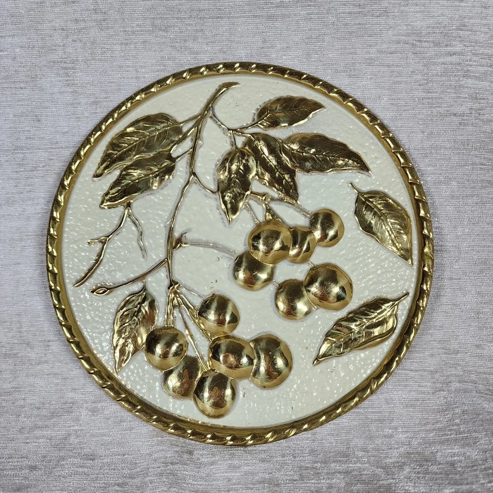 vintage embossed brass wall plaque with mid-century cherries made in Holland
